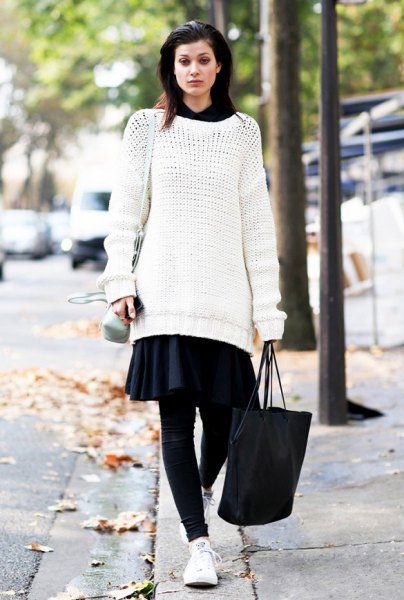 white tunic sweater with black mini skater skirt