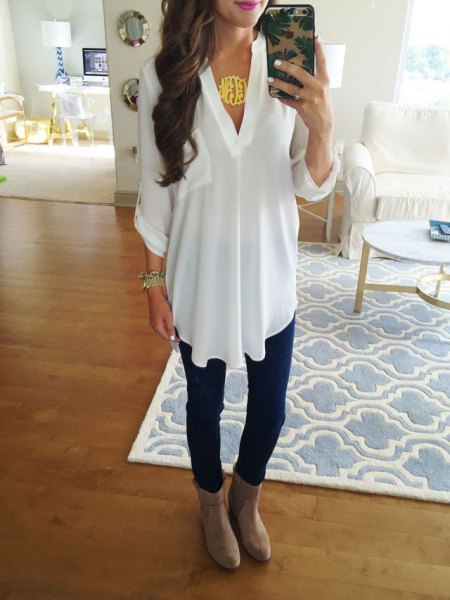 White V-neck tunic top and gray suede ankle boots