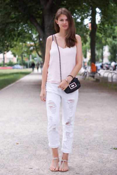V-neck white tank top, ripped boyfriend jeans and flat sandals