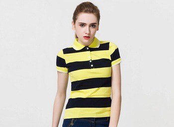 yellow and black, wide striped polo shirt with dark blue skinny jeans