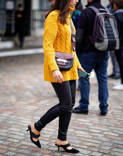 Yellow cable knit sweater and black skinny leather pants