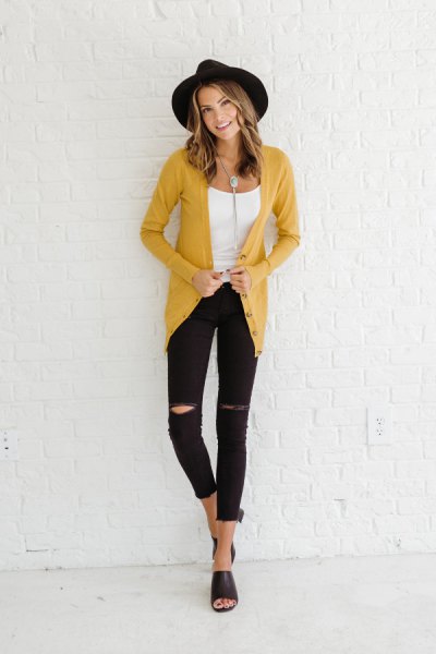 yellow cardigan with white scoop neck tank top and ripped skinny jeans