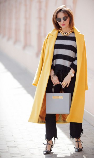 Yellow maxi wool coat with black cropped and ripped jeans