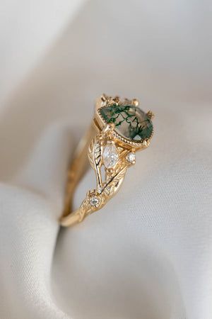 Slip the perfect gemstone engagement rings on her finger!!
