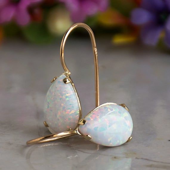 Choose opal earrings for elegant looks