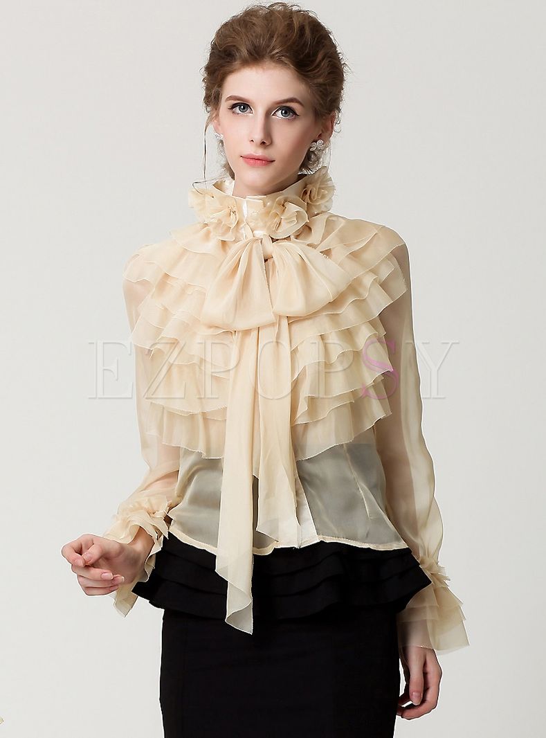 Wear a ruffle blouse and be the queen of our times