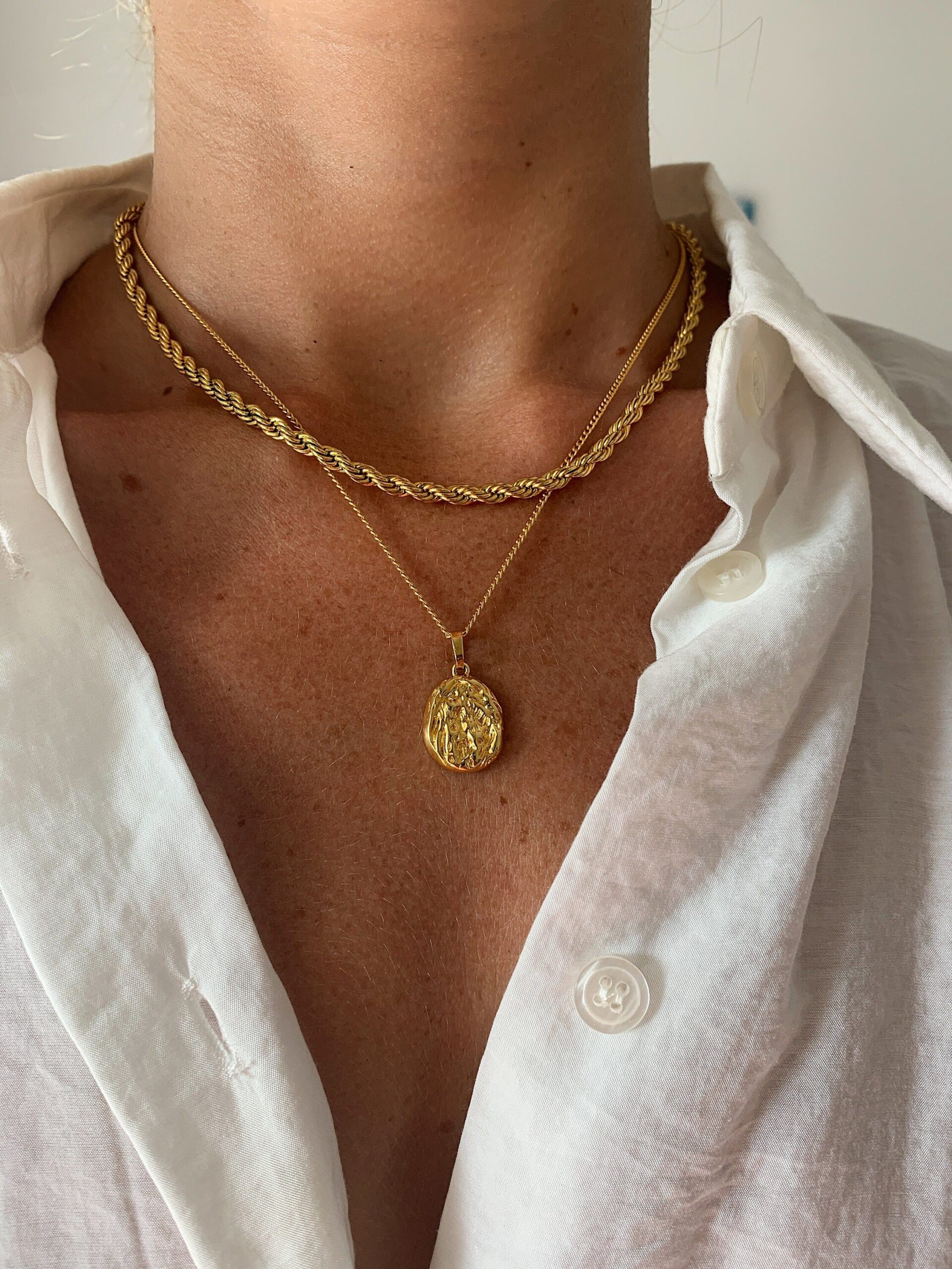 Add elegant gold pendant to your style