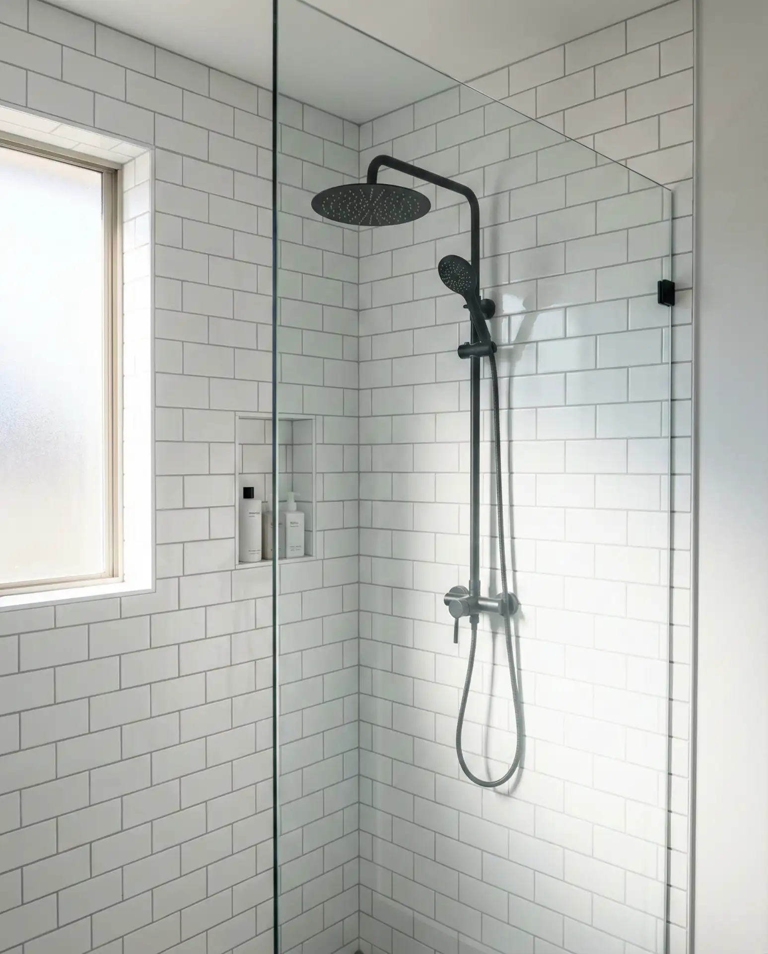 Black Fixtures on White Subway Tile Shower Wall