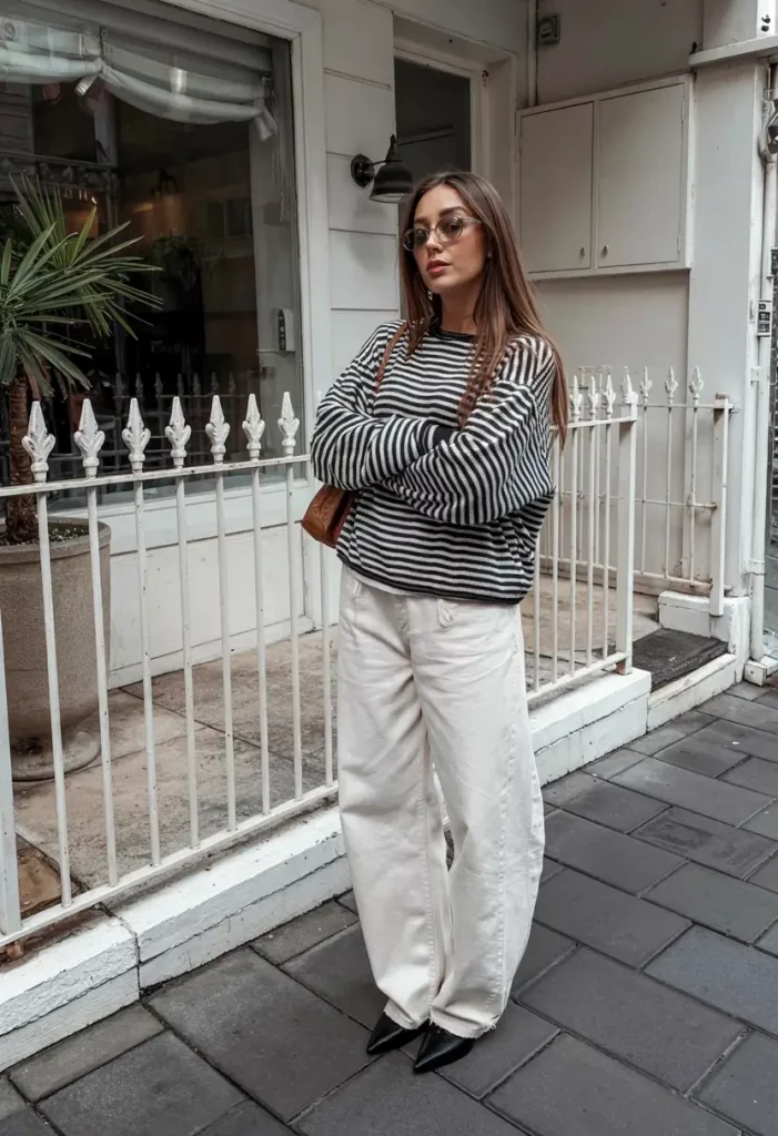 Striped sweater with cream trousers