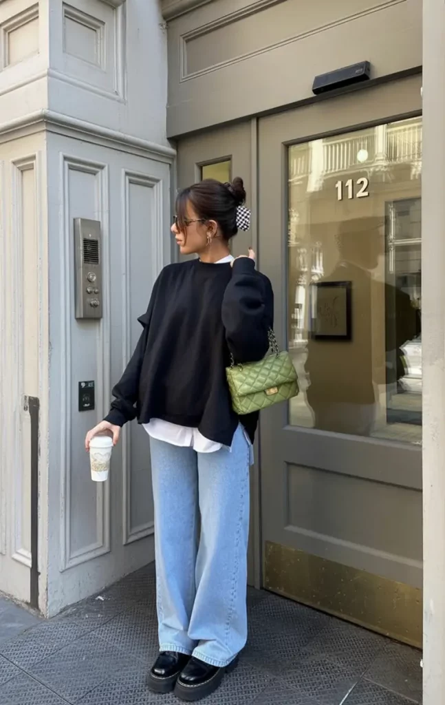 White shirt under black sweatshirt with denim