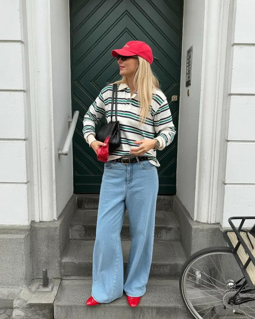 Striped polo with light jeans and red accessories