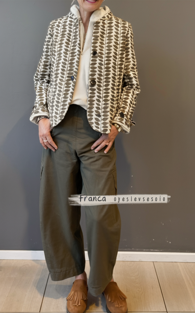 Patterned jacket with olive pants and suede clogs