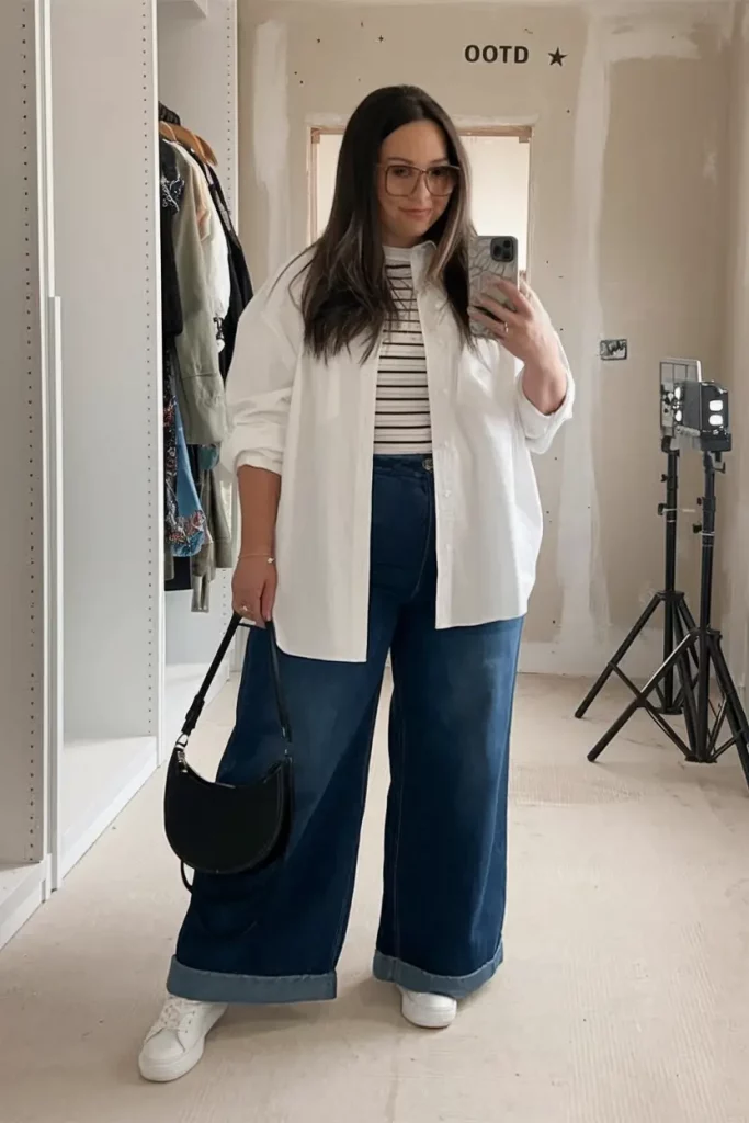 Striped tee with wide-leg denim and white button-down