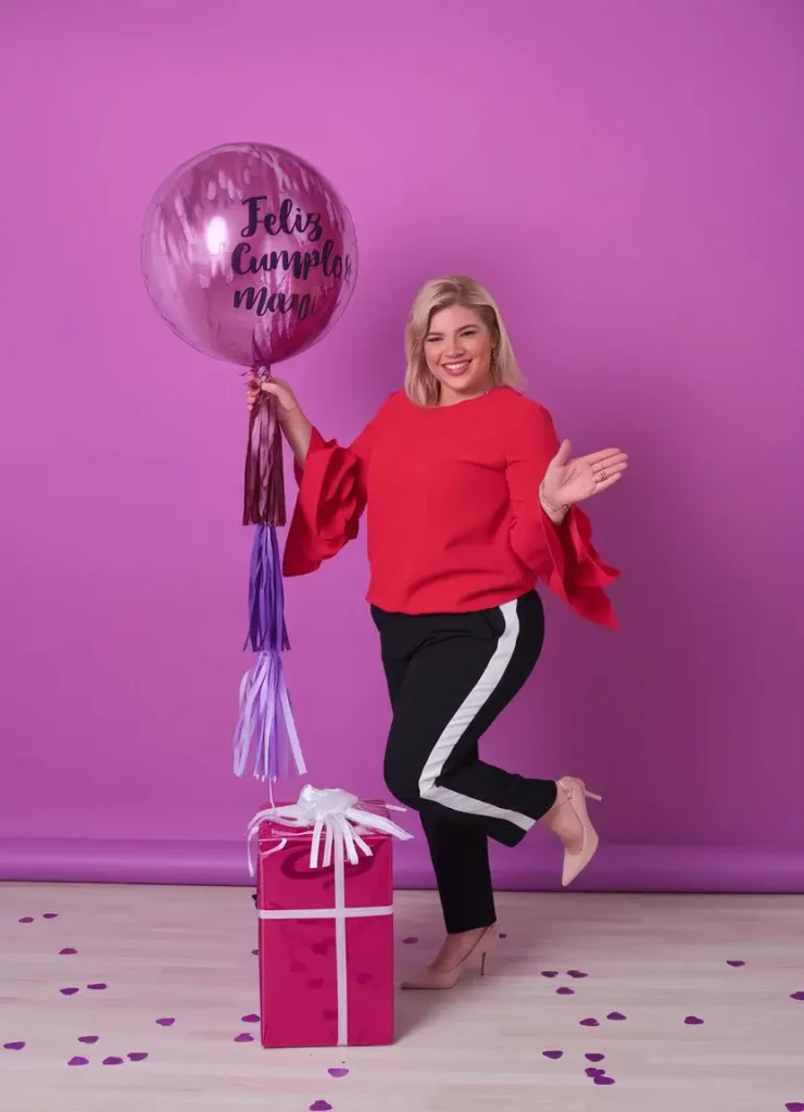 Red ruffle blouse with black side-striped pants