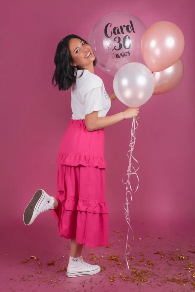 Bright fuchsia tiered skirt with white tee and Converse