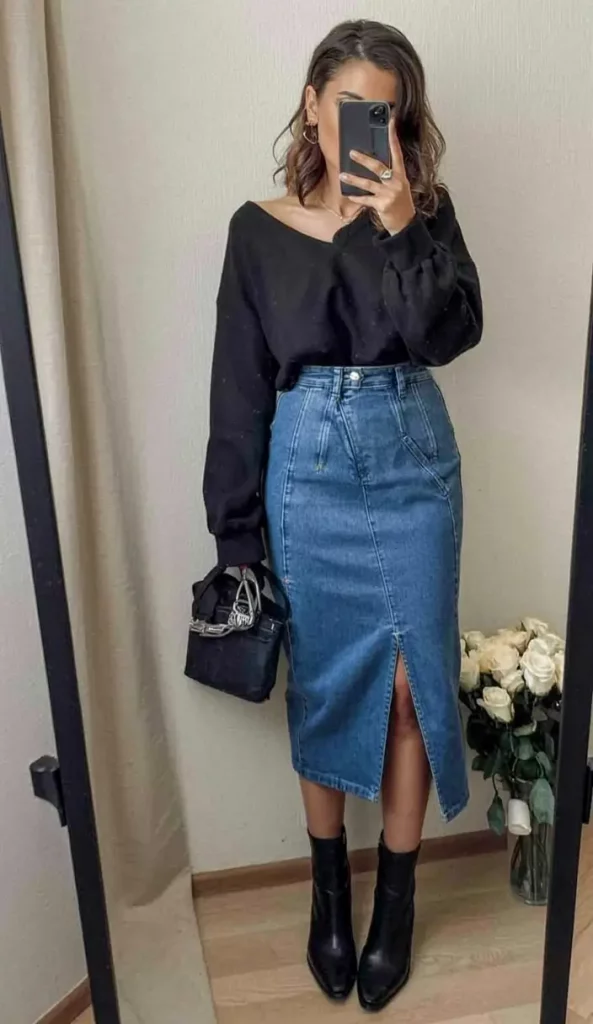 Black blouse with denim midi skirt and black ankle boots