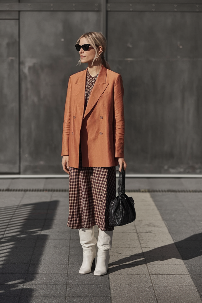 Burnt orange blazer with gingham dress and boots