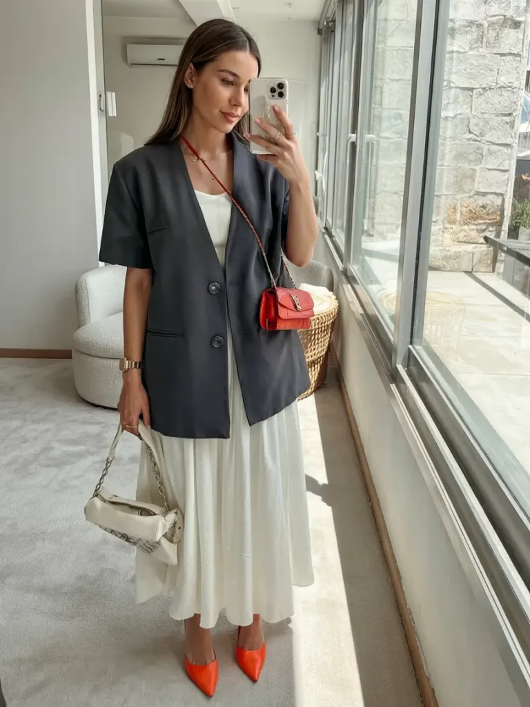 White dress and dark blazer with colorful accessories