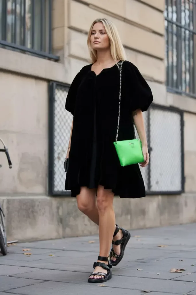 Black dress with neon bag and sandals