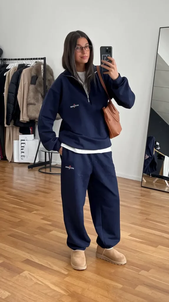 Navy tracksuit with white tee and shearling slippers