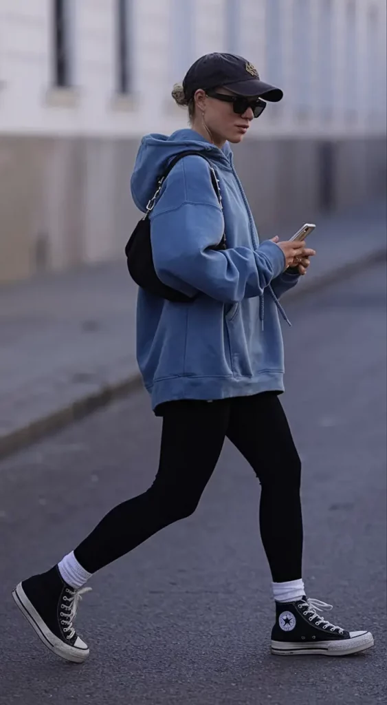 Dusty blue sweatshirt with black leggings and Converse